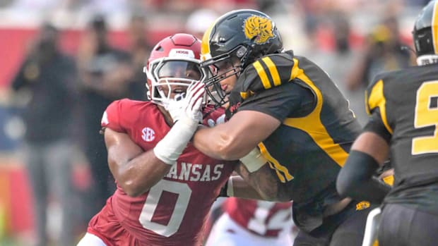 Razorbacks defensive lineman Nico Davillier rushes the passer against UAPB.