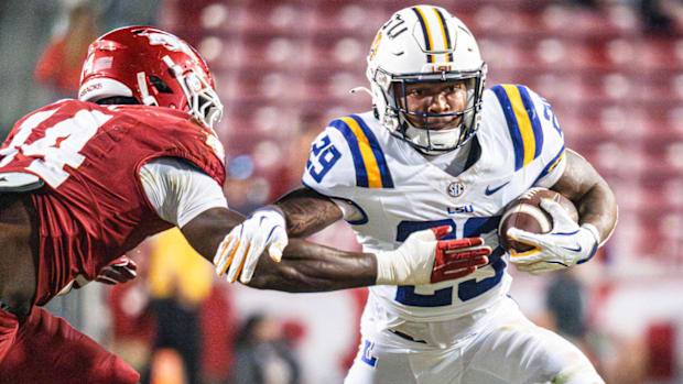 Razorbacks running back Caden Durham gets away from Stephen Dix against LSU