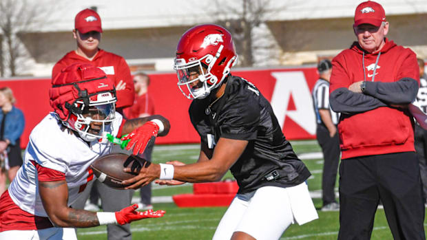 Razorbacks Rodney Hill, KJ Jackson, offensive coordinator Bobby Petrino at spring practice