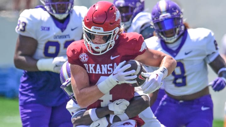 Arkansas Razorbacks tight end Luke Hasz tries to break a tackle against Western Carolina last September at Razorback Stadium in Fayetteville, Ark.