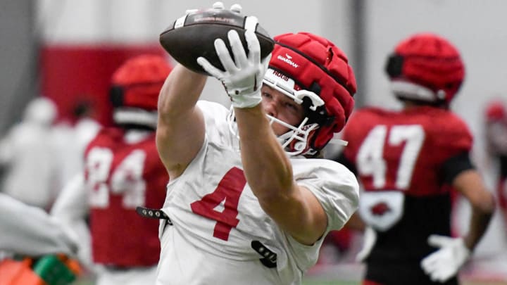 Arkansas Razorbacks' receiver Isaac TeSlaa makes a catch during drills in spring practice inside the football facility in Fayetteville, Ark.