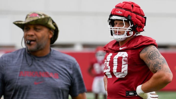 Arkansas Razorbacks defensive lineman Landon Jackson with line coach Deke Adams at summer practice Wednesday in Fayetteville, Ark.