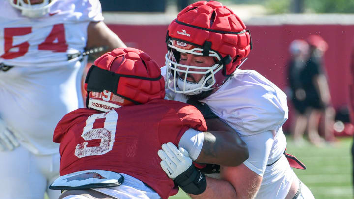 Arkansas Razorbacks offensive lineman Addison Nichols during practice drills against Charlie Collins in Fayetteville, Ark.