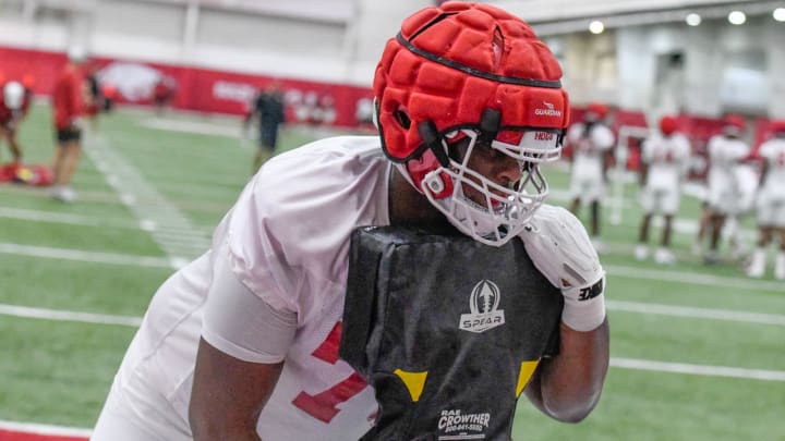 Arkansas Razorbacks offensive lineman E'Marion Harris in drills on the indoor field in Fayetteville, Ark.