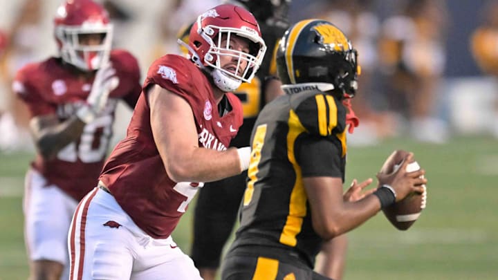 Arkansas Razorbacks defensive lineman Anton Juncaj chases UAPB quarterback Mekhi Hagens in their game at War Memorial Stadium in Little Rock, Ark.