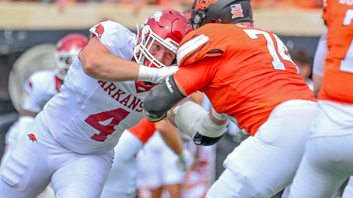 Arkansas Razorbacks Anton Juncaj rushing the passer against Oklahoma State.