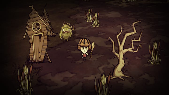 A survivor wears a makeshift hat in a boggy woodland. Nearby a pigman stands near a crooked hut. Don't Starve game.