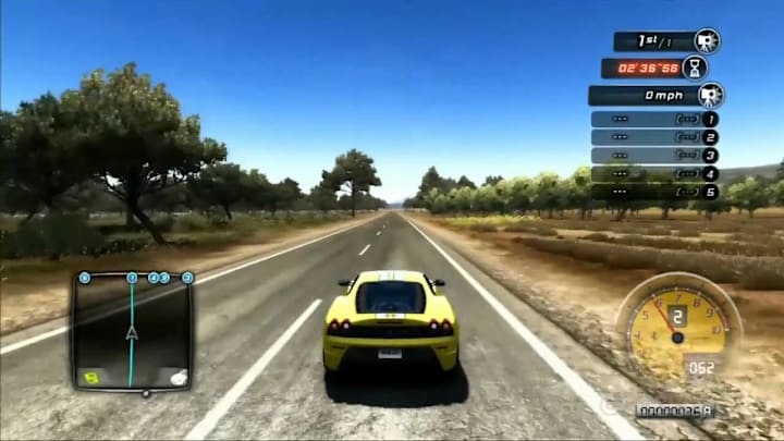A yellow car driving along a straight savannah road.