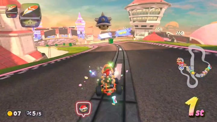 Bowser Jr. with a Blue Shell overhead in Mario Kart World
