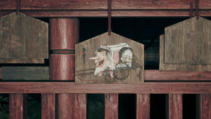 A wooden ema adorned with a two-headed carriage yokai in Silent Hill f