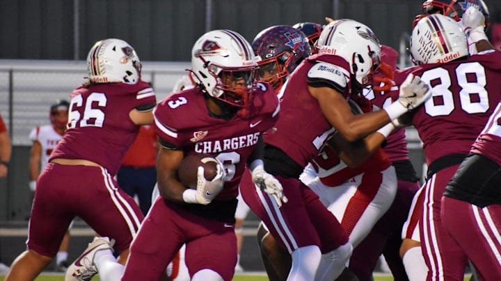 Keller Central junior Dylan McAfee carries the ball during the first quarter of a UIL football game against Justin Northwest at KISD Athletic Complex on Thursday, Oct. 10, 2024. Keller Central junior Dylan McAfee carries the ball during the first quarter of a UIL football game against Justin Northwest at KISD Athletic Complex on Thursday, Oct. 10, 2024.