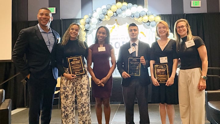 Montgomery County Sports Hall of Famers Oguchi Onyewu (left), Thea LaFond (third from left) and Haley Skarupa (right) with Unsung Sports Heroes Award winners Brett Riley (second from right), Muhammad Arif Wali (center) and Caprina Pipion-Williams (second from left). 