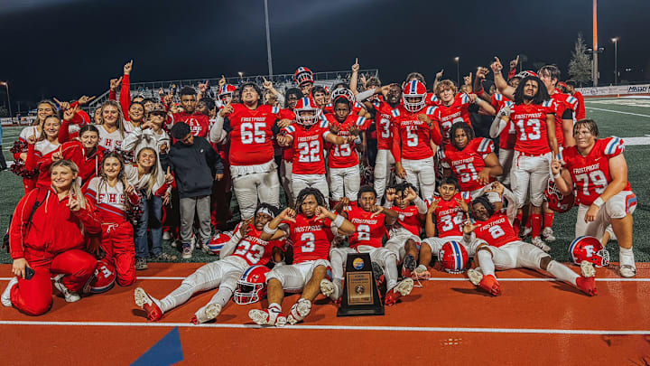 The Frostproof players and cheerleaders celebrate the school's first football state championship in 25 years after defeating Fernandina Beach, 27-8, in the Sunshine State Athletic Association Atlantic League State Championship game.