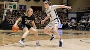 Army freshman Reese Ericson, left, pulls up on her dribble against Navy on Saturday. 