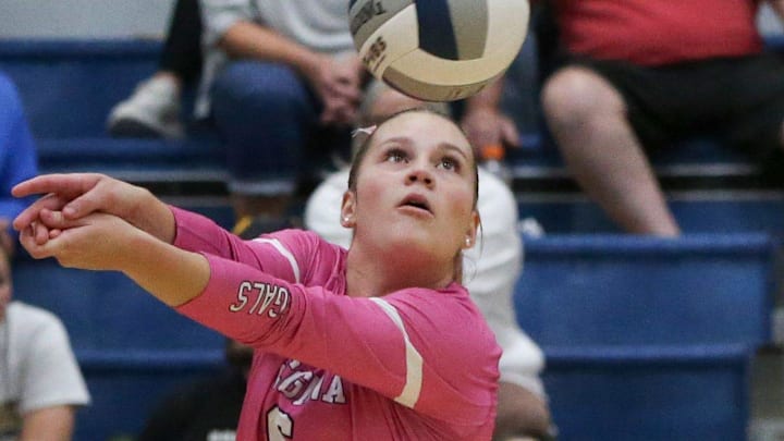 Regina Catholic’s Reese Naeve (6) passes the ball against Mid-Prairie Tuesday, Oct. 8, 2024 in Iowa City, Iowa.