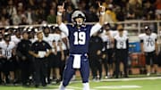 Lake Oswego High School quarterback Hudson Kurland, shown here celebrating during the Lakers’ 45-31 win over Tualatin back on Oct. 4, announced his college commitment to Washington State University.