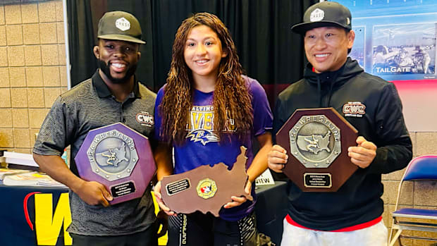Taina Fernandez with Capital Wrestling Club coaches Elijah Oliver (left) and Jay LaValley.