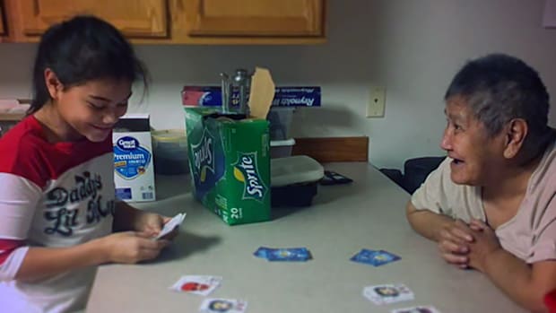Roberta Amelia Fawcett, the namesake and great grandmother of Amelia Fawcett, plays Rummy with young Amelia.