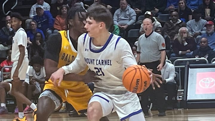 Mount Carmel junior Ralph Rudusans (21) had arguably his best game of the season Saturday. The 6-foot-6 forward had a team-high 17 points as the Cougars won their first MIAA A Conference basketball crown with a 55-50 decision over St. Frances Academy. Mount Carmel junior Ralph Rudusans (21) had arguably his best game of the season Saturday. The 6-foot-6 forward had a team-high 17 points as the Cougars won their first MIAA A Conference basketball crown with a 55-50 decision over St. Frances Academy.