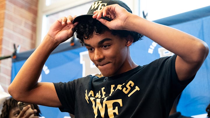 Principia senior guard Quentin Coleman reveals the Wake Forest hat and shirt as he announces his college commitment on Tuesday, October 14, 2025, at The Principia School in Des Peres, Mo.