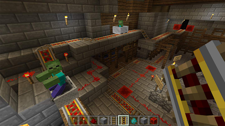Zombies riding along an elobrate minecart track hooked up to lots of Redstone.