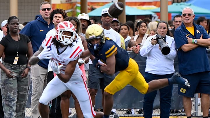 Chris Henry Jr. hauls in a 23-yard pass from Ryan Hopkins for a touchdown in Mater Dei's win over St. Thomas Aquinas on Aug. 23. Chris Henry Jr. hauls in a 23-yard pass from Ryan Hopkins for a touchdown in Mater Dei's win over St. Thomas Aquinas on Aug. 23.