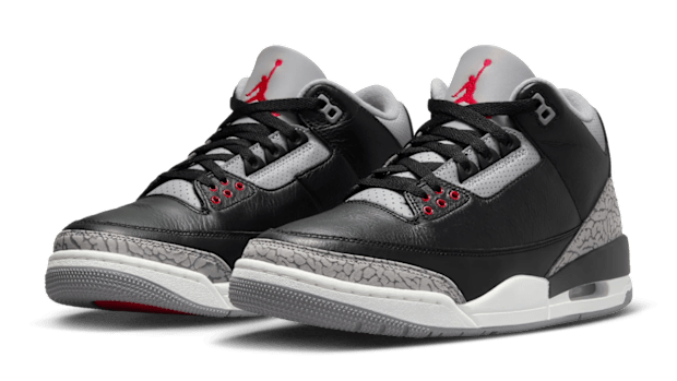 Side view of black and grey Air Jordan sneakers.