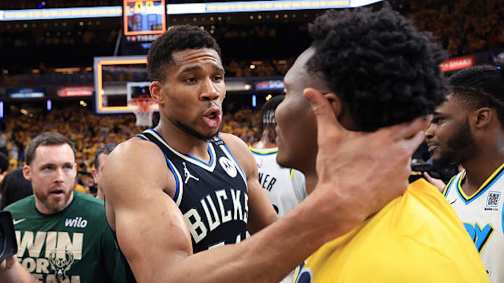 Giannis Antetokounmpo grabs Bennedict Mathurin by the back of the head. Giannis Antetokounmpo grabs Bennedict Mathurin by the back of the head.