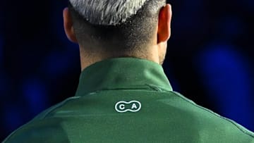 Carlos Alcaraz's initials on the back of his NikeCourt Heritage jacket.