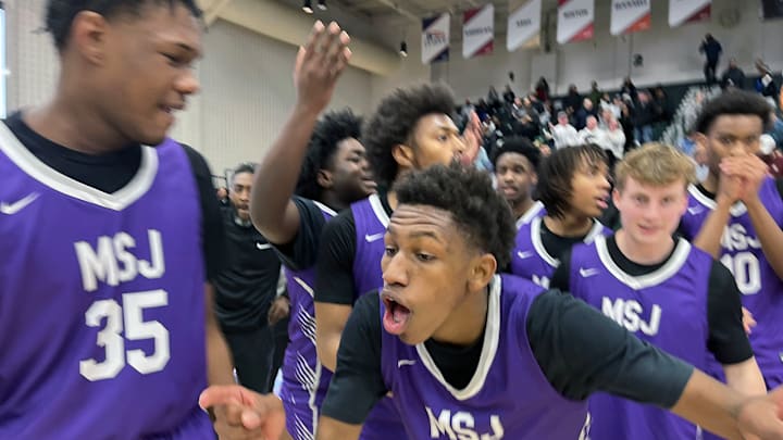 BJ Ranson celebrates with his Mount St. Joseph’s teammates after Sunday’s Baltimore Catholic League Tournament semifinals. His 3-pointer with a second left in regulation gave the Gaels a 58-56 win over defending champs St. Frances Academy at Loyola University’s Reitz Arena.