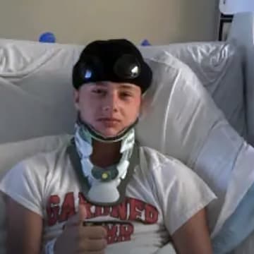 Chuckey-Doak football player Ethan Heimiller flashes a thumbs up from his hospital bed at the University of Tennessee Medical Center, after being airlifted there following a serious hit during his team's game on Friday. He temporarily lost feeling in his legs.