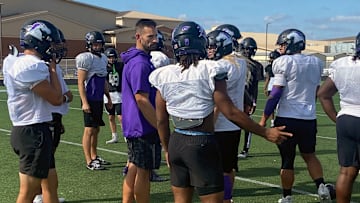 Fulshear football coach Nick Codutti discusses a play call with one of his players during practice this week as the Chargers prepare for Friday's playoff game against Atascocita.