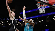 Danny Wolf dunked on Miles Bridges during a Nets win.