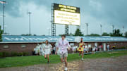 Fans run for cover at Churchill Downs.