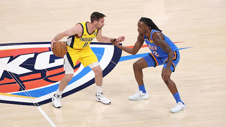 T.J. McConnell has his arm held by Cason Wallace during Game 7 of the NBA Finals. 