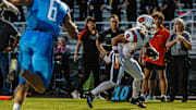 Oviedo High wide receiver Emiliano Galarza (0) looks for running room against Hagerty in a 2024 regular-season game. Galarza is one of multiple key returnees this year for the Lions.