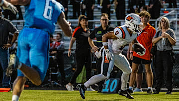 Oviedo High wide receiver Emiliano Galarza (0) looks for running room against Hagerty in a 2024 regular-season game. Galarza is one of multiple key returnees this year for the Lions.