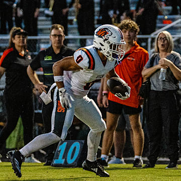 Oviedo High wide receiver Emiliano Galarza (0) looks for running room against Hagerty in a 2024 regular-season game. Galarza is one of multiple key returnees this year for the Lions.