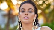 Sixtine was photographed by Derek Kettela in Belize. Swimsuit by ANTONINIAS. Earrings by Alexis Bittar.