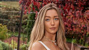 Penny Lane was photographed by Ben Watts in Portugal. Swimsuit by Swim Like A Mermaid Necklace by Child of Wild.