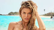 Brooks Nader was photographed by Ben Watts in Bermuda. Swimsuit by Elisabetta Franchi.