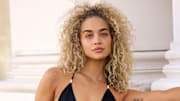 Jasmine Sanders was photographed by Derek Kettela in Zurich, Switzerland. Swimsuit by Hanne Bloch. Jacket by Retrofete.