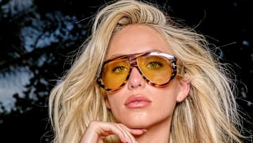 Alix Earle was photographed by Yu Tsai in Mexico. Swimsuit by Tom Ford Sunglasses by Tom Ford