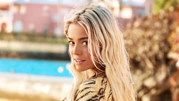 Olivia Dunne was photographed by Ben Watts in Bermuda. Swimsuit by Tropic of C.
