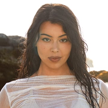 Lauren Chan was photographed by Ben Watts in Bermuda. Swimsuit by It’s Now Cool. Shirt by Enza Costa.