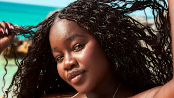 Achieng Agutu was photographed by Ben Watts in Bermuda. Swimsuit by iNAMORATA WOMAN.
