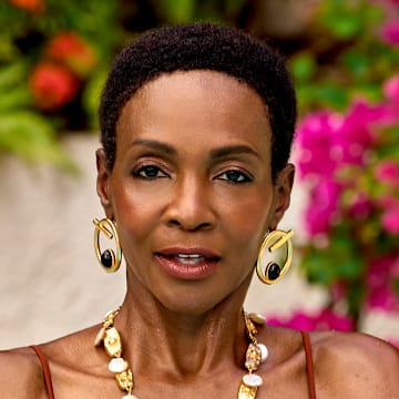 Roshumba Williams was photographed by Yu Tsai in Jamaica. Swimsuit by Johanna Ortiz. Earrings by Ben-Amun. Necklace by Presley Oldham. 