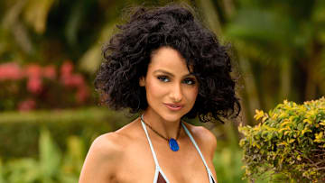 Nazanin Mandi was photographed by Yu Tsai in Jamaica. Swimsuit by Bad N Bare. Necklace by Eric Silva.