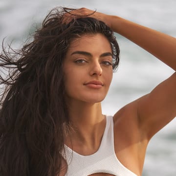 Toni Breidinger was photographed by Ben Horton at The Boca Raton. Swimsuit by LATITID.
