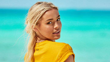 Olivia Dunne was photographed by Ben Watts in Bermuda. Shirt by MONSE.